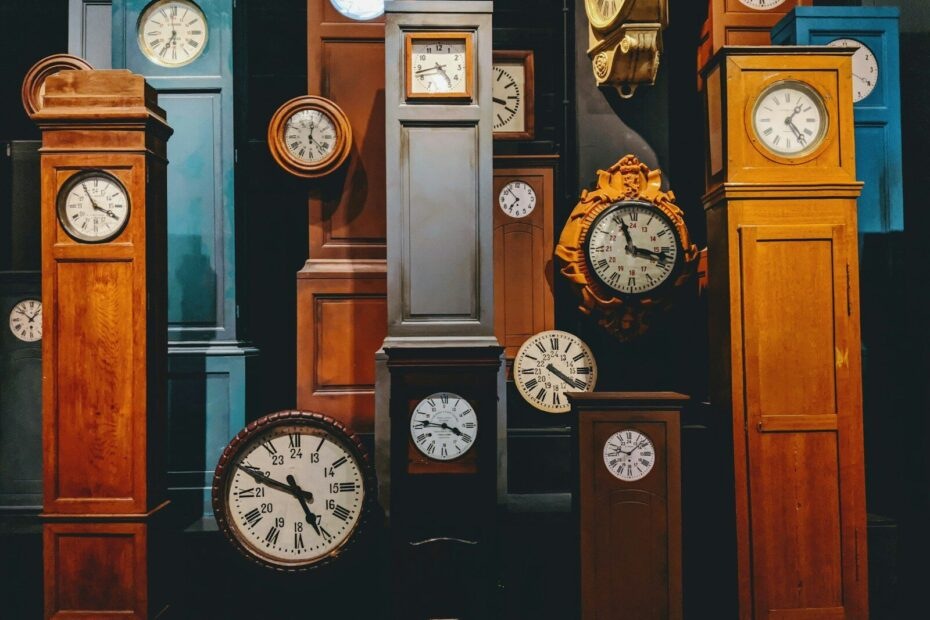 brown wooden framed analog clock