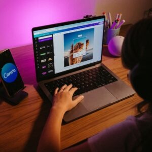 girl using canva website on laptop